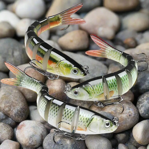 Three multi-jointed fishing lures designed to mimic real baitfish for effective fishing.