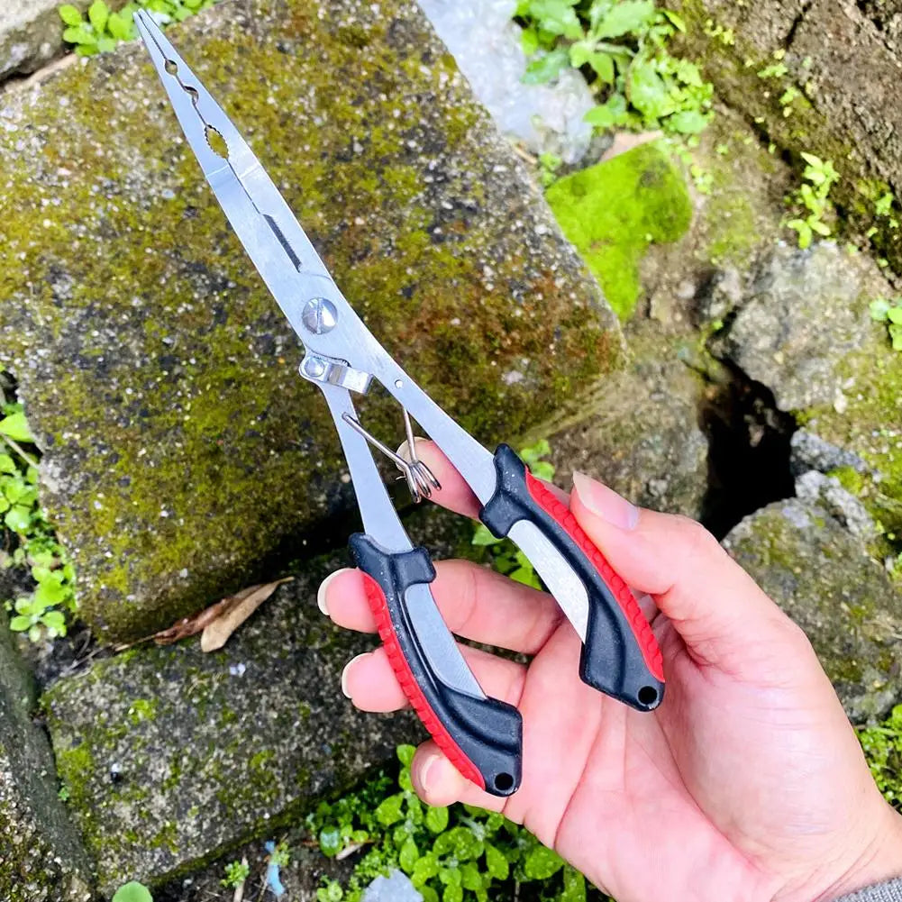 Hand holding stainless steel fishing pliers with ergonomic grips for easy fishing tasks