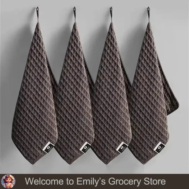 Set of four super absorbent fishing towels in a dark color, designed for quick drying and convenience