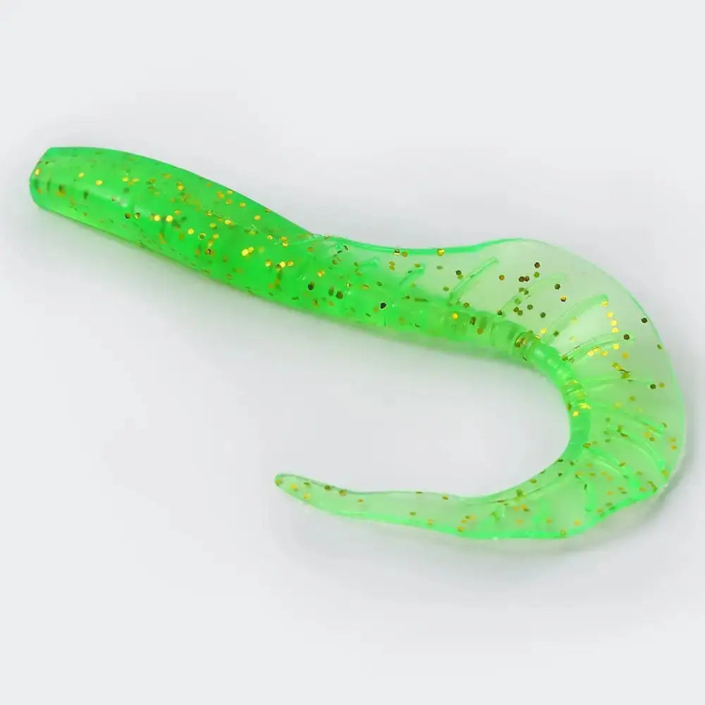 Green plastic fishing lure with gold glitter.