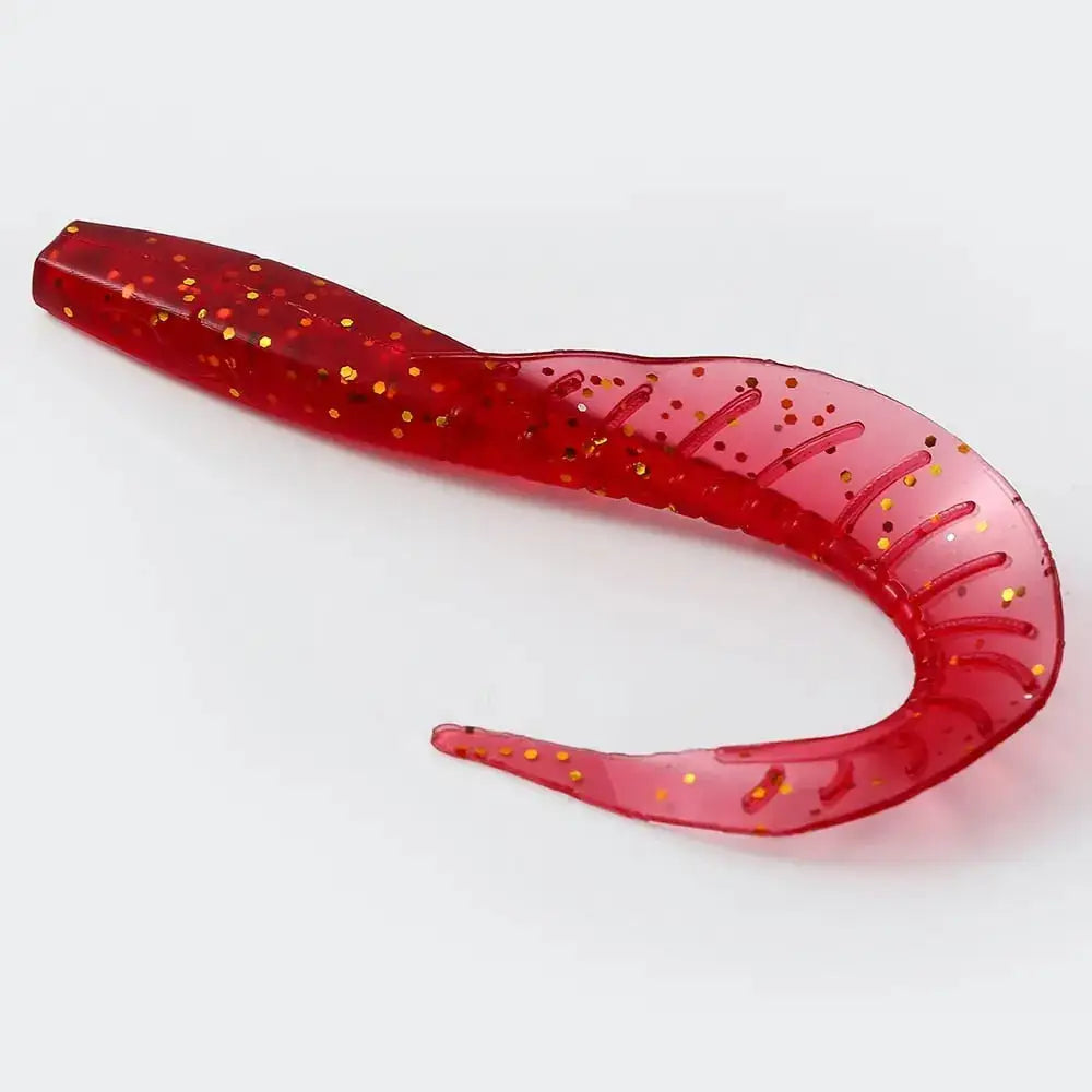 Red plastic fishing lure with gold glitter.