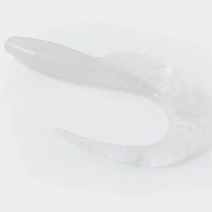 Translucent, curved, silicone sex toy.