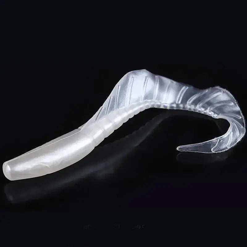 Translucent, flexible plastic dental aligner.