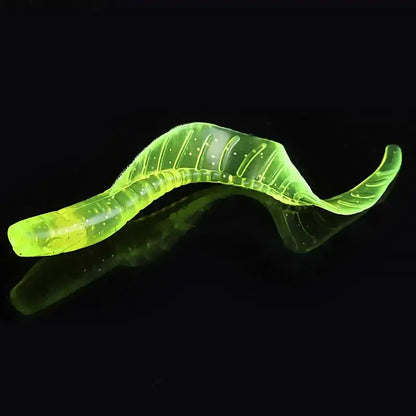 Translucent, chartreuse, ribbed fishing lure.