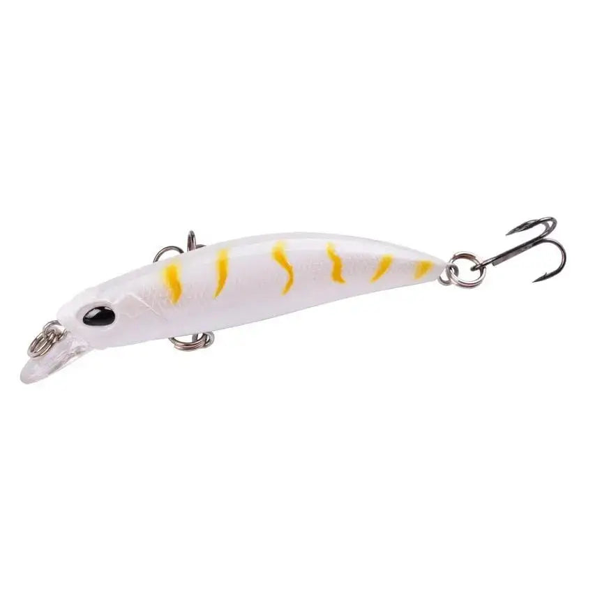 White and yellow fishing lure with treble hooks.