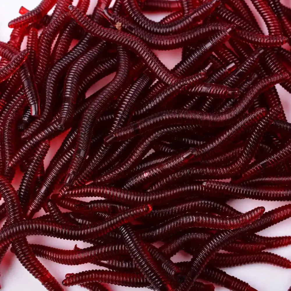 Pile of red, ribbed, worm-like objects.