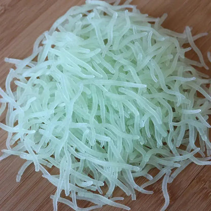 Translucent, pale green, noodle-like strands.