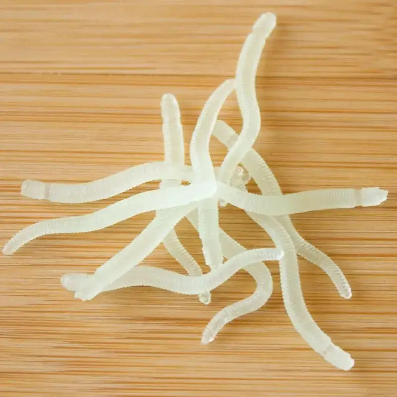 Translucent, wavy, noodle-like objects.