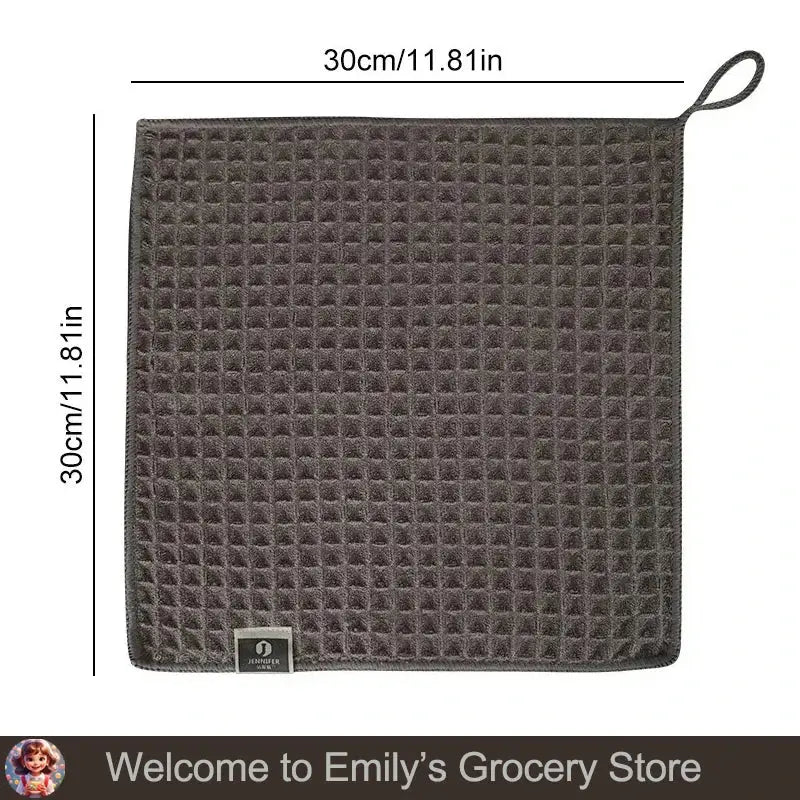 Square, gray waffle-textured towel with hanging loop.