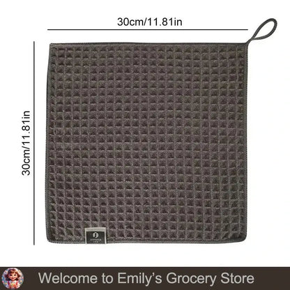 Square, gray waffle-textured towel with hanging loop.