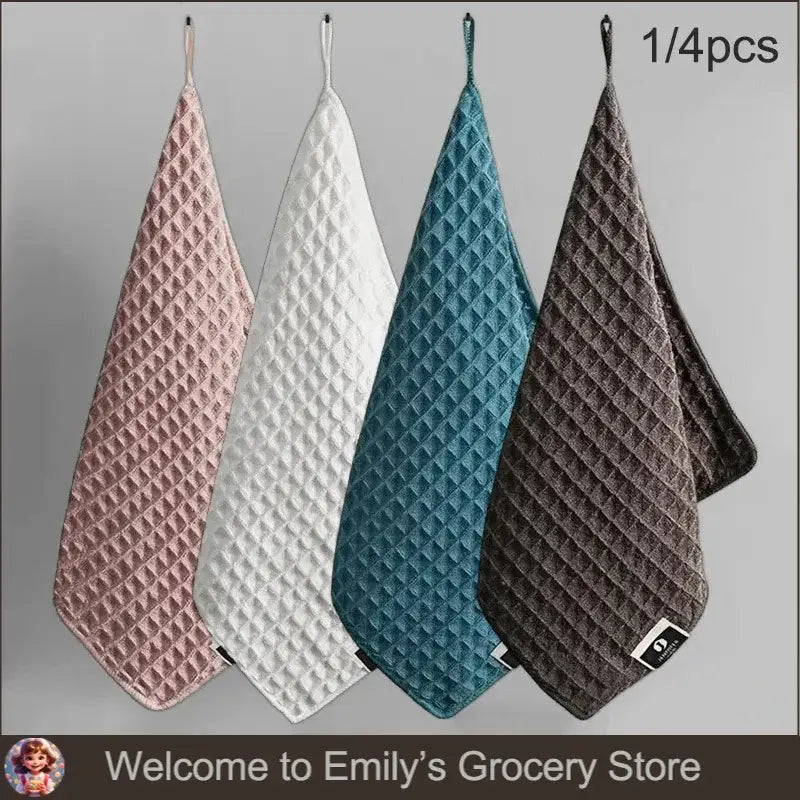 Four waffle-textured hanging towels.