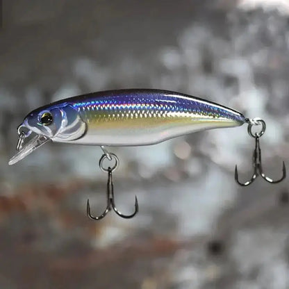 Shiny fishing lure with treble hooks.