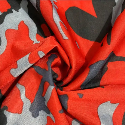 Red, gray, and black camouflage fabric.