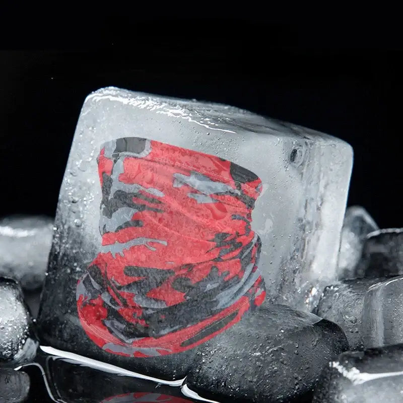 Red and gray camouflage neck gaiter frozen in ice.